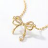 Étoile bow diamond pendant necklace